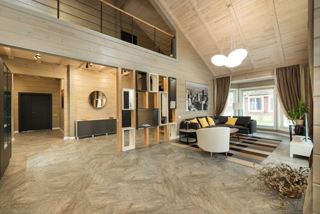 An open-plan timber living room with a mezzanine above